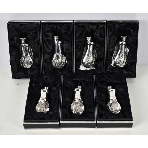 355 - A group of seven James Dixon & Sons small Cornish pewter flasks, decorated with the Colts Patent Bab... 