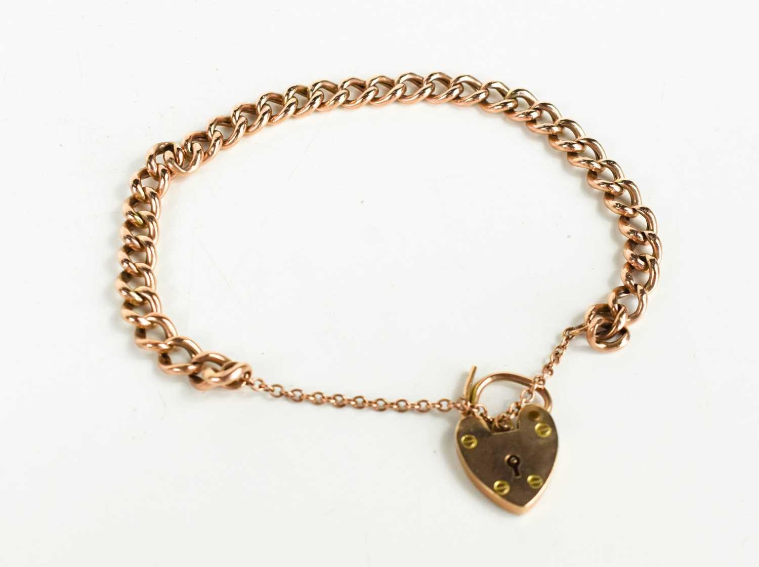 Lot 120 - A 9ct gold charm bracelet