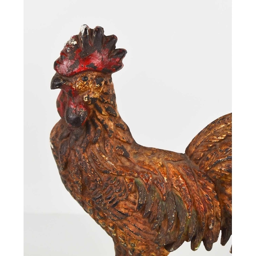 106 - An American antique door stop in the form of cockerel, with original residual paintwork, 22cm high.