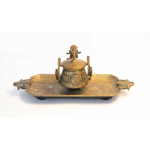 114 - An Egyptian Revival brass inkstand, the cover having a finial modelled as Baphomet / Mendes, above t... 