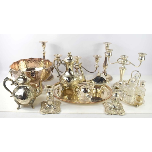 126 - A collection of silver plated items to include candelabra, punch bowl, tea and coffee pot, candlesti... 