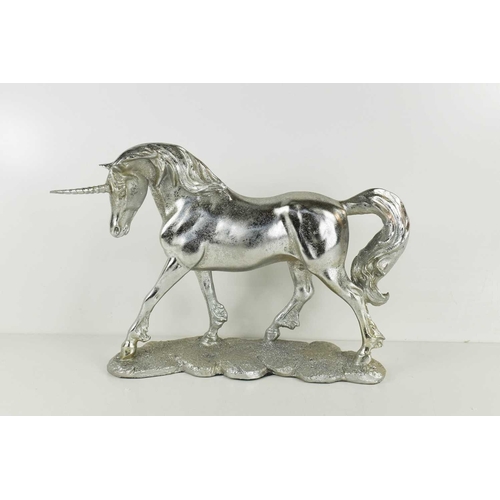148 - A silvered plaster figure of a unicorn.
