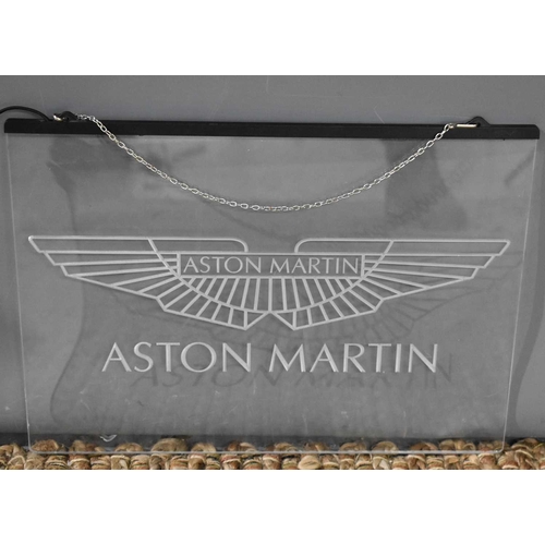 167 - A perspex etched Aston Martin sign, 29 by 40cm.