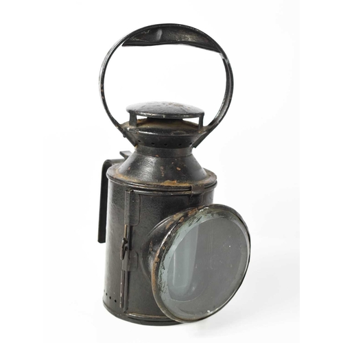 169 - A London Transport lantern, black painted iron, 31cm high.