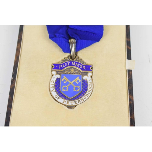 242 - A silver key, medal and brooch awarded to the Mayor and Mayoress of Peterborough, the key presented ... 