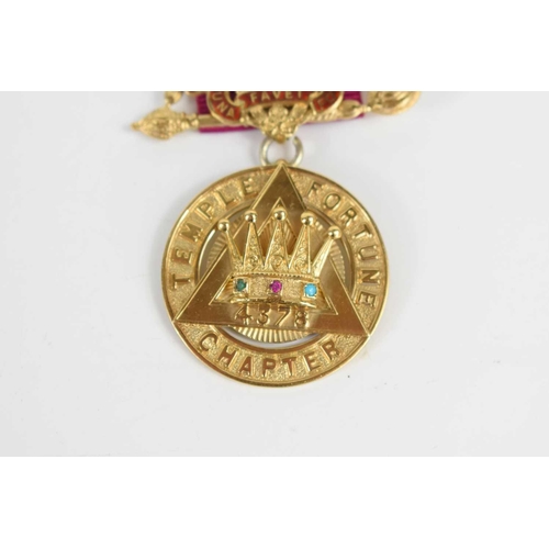 25 - Masonic Interest: A 9ct gold jewel on ribbon, Temple Fortune Chapter, the jewel set with a pink emer... 