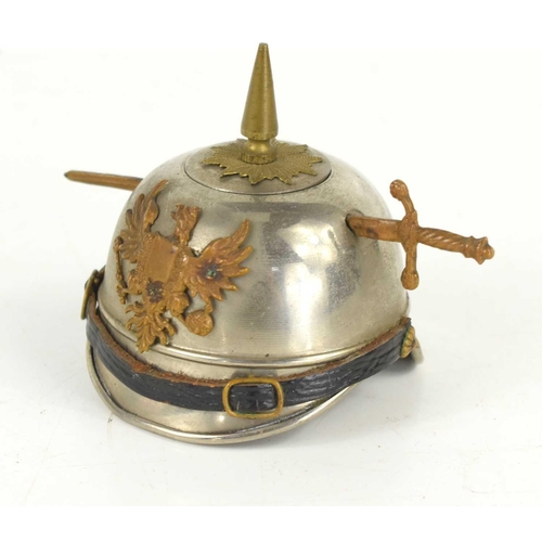 27 - WW1 Trench Art: An inkwell made in the form of a German soldiers Pickelhaube helmet.