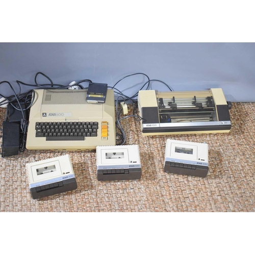 280 - A vintage Atari 800 computer system together with three Atari 1010 cassette recorders and an Atari 1... 