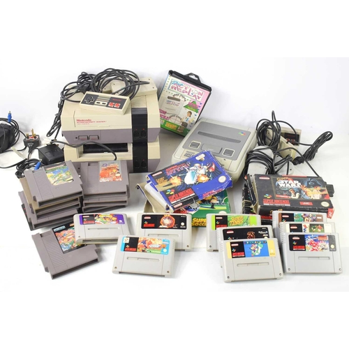 286 - Two vintage Nintendo NES games consoles and a Super Nintendo games console together with various gam... 