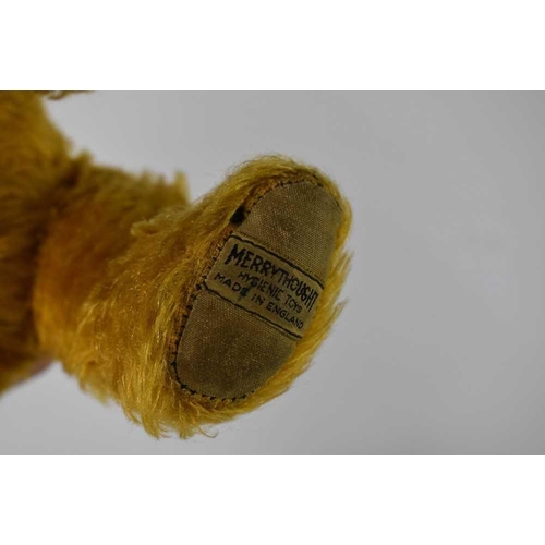 289 - A vintage Merrythought bear, circa 1950, with embroidered label to the foot, 30cm long, together wit... 