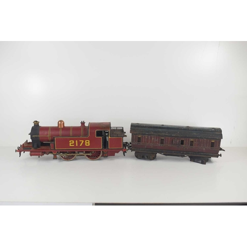 295 - A vintage O gauge live steam locomotive together with a Midland Railway cattle carriage.