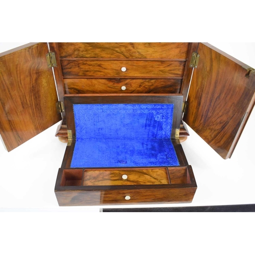 337 - A late Regency walnut work box of sarcophagus form, the lid lifts to reveal a fitted sewing tray wit... 