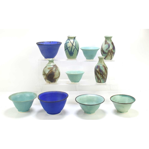 387 - Heather Graham(20th century): A collection of studio pottery to include bowls in blue and green glaz... 