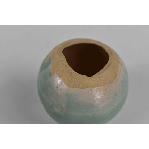 410 - A small Studio pottery spherical vase, initialled to the rim G.H., with a celadon blue coloured glaz... 