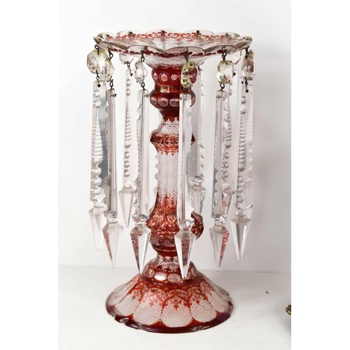 422 - A Victorian cut glass lustre, decorated with red overlay and etching to the flared rim, knopped stem... 