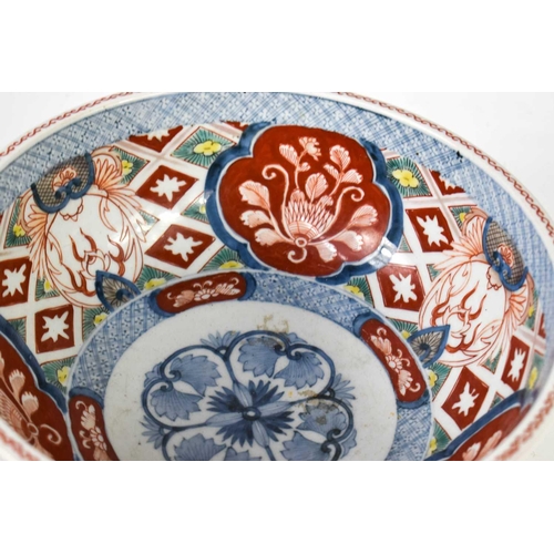 434 - A 19th century Japanese Imari style bowl, decorated inside and out, and bearing blue mark to the bas... 