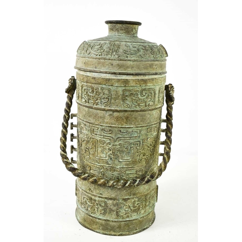 435 - A Chinese archaistic vessel and cover, with rope twist handle and cast with decoration to the body a... 