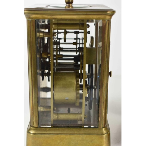 456 - A French brass carriage clock, with Roman numeral dial, and with key, 17cm to top of handle.