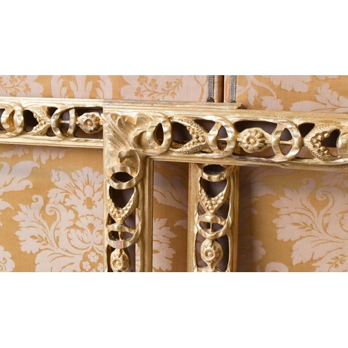 489 - A pair of modern giltwood carved and pierced frames, in the 17th century style, 111 by 85cm.