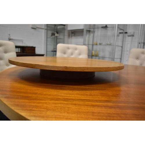 529 - A Mid-Century Ercol style circular top dining table, 152cm diameter with matching Lazy Susan measuri... 