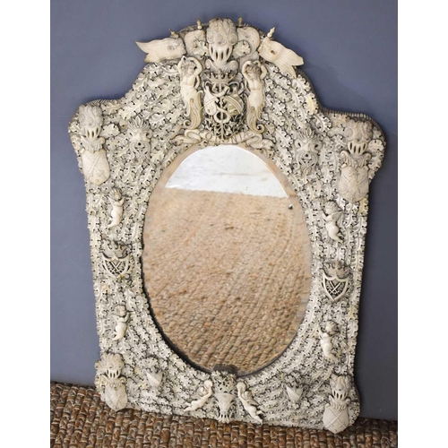 542 - An impressive 19th century French Dieppe bone carved mirror, possibly made by a prisoner of war, the... 