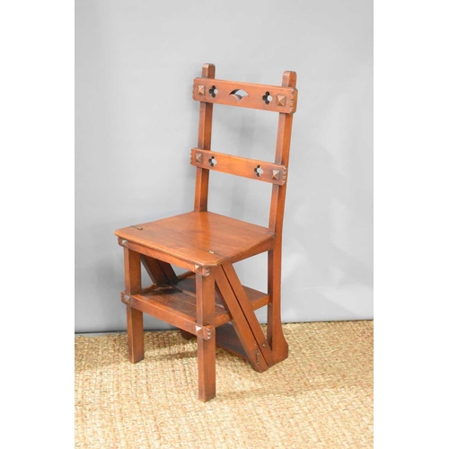 544 - A Victorian Gothic Revival metamorphic step chair, the two back rails having pierced decoration in t... 