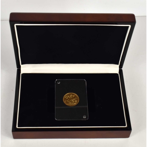 57 - A Queen Victoria gold sovereign with Jubilee head, dated 1892, set within a sealed plastic capsule.