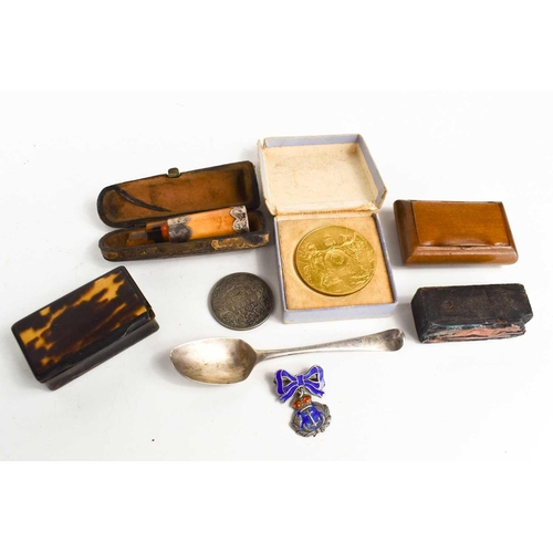 78 - A silver spoon, silver and enamel Naval badge, a 1901 Indian Rupee, A George V and Queen Mary gilded... 