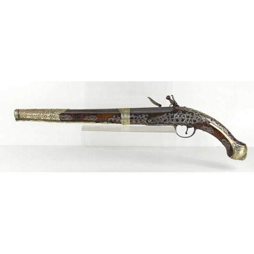 8 - A late 18th century highly decorated flintlock pistol with inlaid silver decoration throughout, the ... 