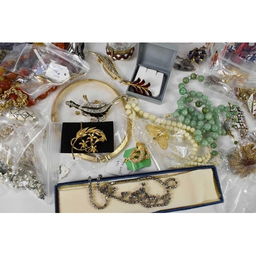 83 - A large selection of vintage and later jewellery including silver examples, jade beaded necklaces, p... 