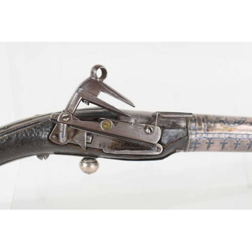 9 - A 19th century Turkish flintlock pistol, the steel barrel overlaid with decorated silvered panels, w... 