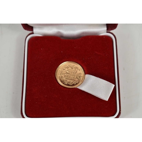 98 - A Queen Elizabeth II, 2002 shield back gold half sovereign with original box.
