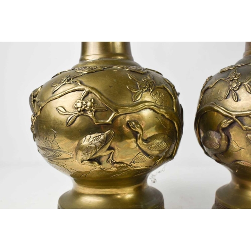 106 - A pair of Chinese bronze vases, the bodies decorated with waterfowl amongst reeds and prunus blossom... 