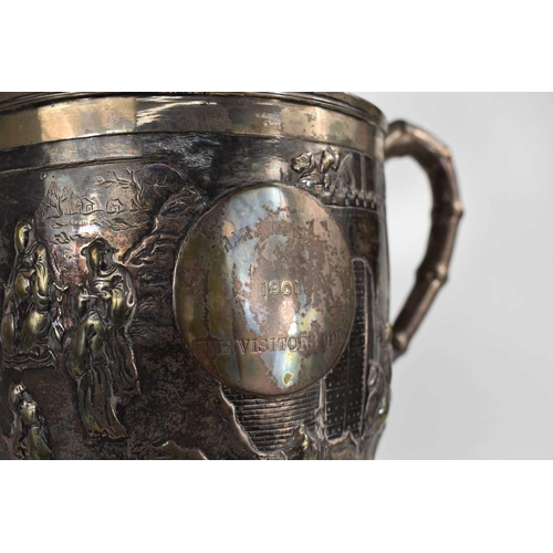 109 - An early 20th century Chinese silver trophy by Luen Wo, Shanghai, with chased and repousse hunting s... 