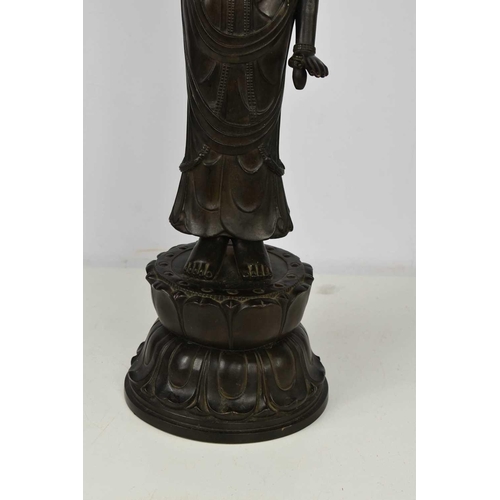 113 - A bronze statue of standing Bodhisattva, raised on a lotus form base, signed verso, 69cm high.