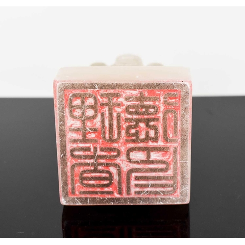 127 - A Chinese soapstone seal, carved with a mythical creature sitting atop a stepped square form base, 6... 