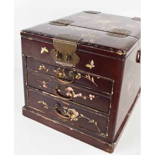 140 - A 19th century red lacquered Chinese vanity case, with mother of pearl inlaid bird of paradise to th... 