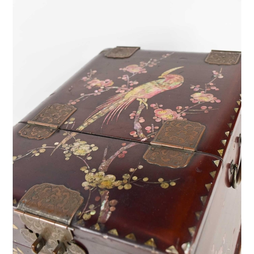 140 - A 19th century red lacquered Chinese vanity case, with mother of pearl inlaid bird of paradise to th... 