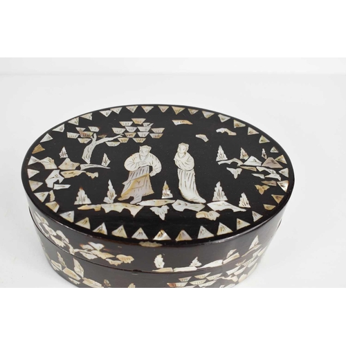 141 - A Chinese black lacquered and mother of pearl inlaid oval box, depicting figures engraved with detai... 