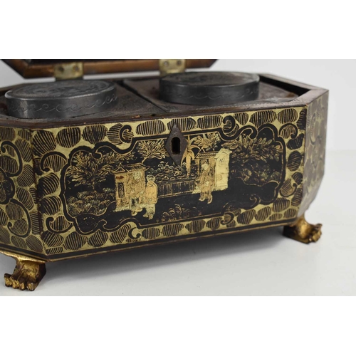 159 - A 19th century black lacquered Chinoiserie decorated tea caddy, with two pewter interior canister li... 