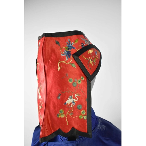 169 - A Chinese lady's silk waistcoat, embroidered in a bamboo design, with mesh overlay, 23cm long, a fin... 