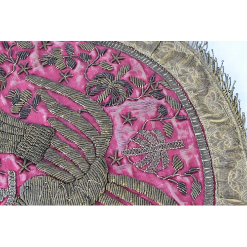 197 - A silk, embroidered altar cloth centrepiece, likely Judaic, the red silk ground embroidered with a d... 