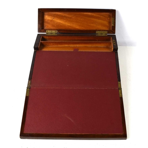 258 - An antique mahogany writing box, the two lids opening to reveal two interior drawers and a compartme... 