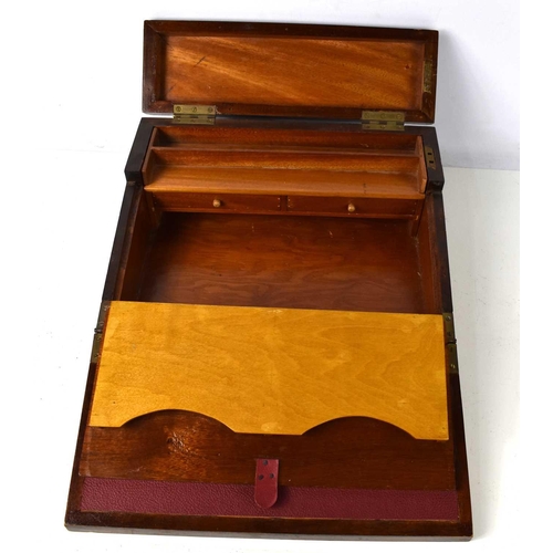 258 - An antique mahogany writing box, the two lids opening to reveal two interior drawers and a compartme... 