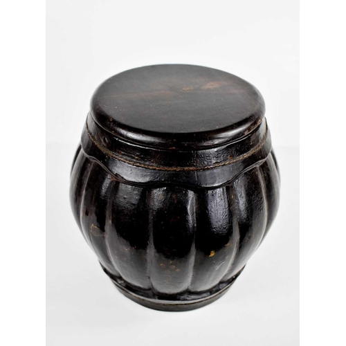 264 - A Chinese Qing Dynasty wooden rice jar and cover, of lobed form, black lacquered to depict a house i... 