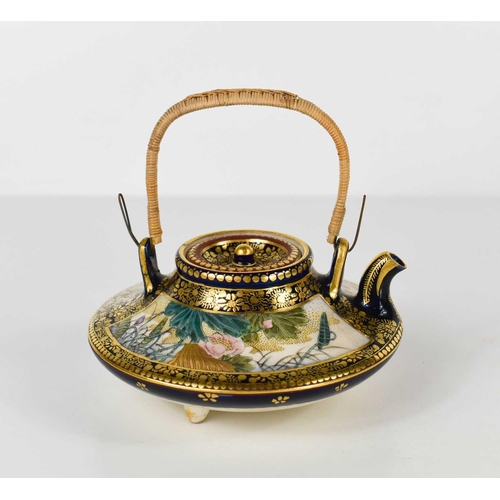 27 - A fine Qing Dynasty Chinese teapot of squat form, decorated with figures on one side and water lilys... 