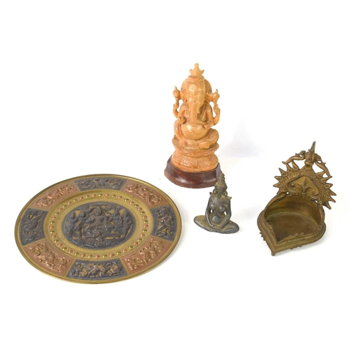 279 - A cast bronze oil lamp, Tamil Nadu region, 12cm high together with a carved figure of Ganesha, an en... 