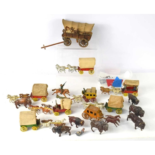 283 - A group of vintage diecast covered wagons and stagecoaches with horses, possibly made by Moorestone ... 