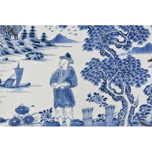 33 - An early 19th century Chinese blue and white charger, depicting a figure standing beside a tree with... 