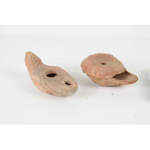 344 - Three Romano-Egyptian oil lamps, circa 4th / 5th century, together with a modern example.